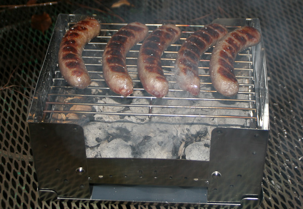 grillin' brats over charcoal and hickory chips